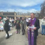 Hundreds gather for ecumenical Palm Sunday worship service, protest